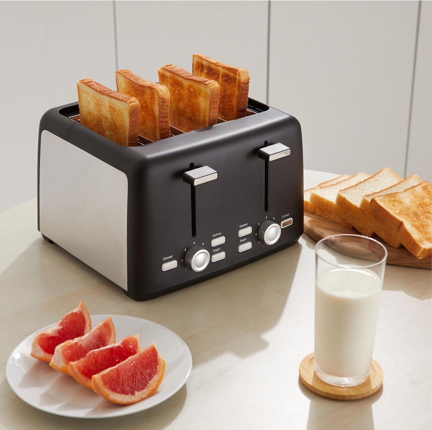 Amazon Basics 4 Slice Toaster, With 7 Browning Settings, Extra Wide Slots For Bagels and Special Breads, Removable Easy-to-Clean Crumb Trays, Cancel/Defrost/Bagel Buttons, 1500W, Black & Silver